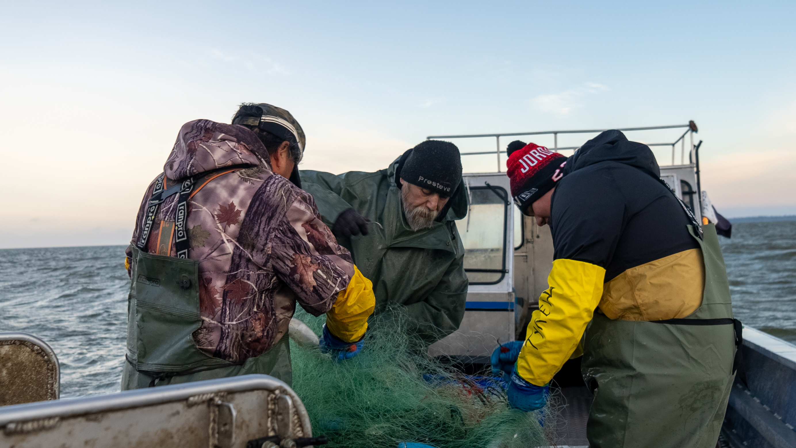 Indigenous fishers from Cedar Lake Walleye and Northern Pike Fisheries harvesting fish on Cedar Lake, Manitoba.